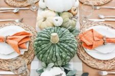 21 a bright and fun Thanksgiving table with leaves, pastel and white pumpkins, woven chargers and orange napkins