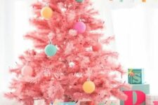 22 a cool candy pink Christmas tree decorated with a bit of pastel-colored ornaments looks gorgeous, modern, fresh and very pretty
