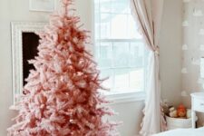 23 a pink Christmas tree with no decor at all but a chunky knit cover for the base is an awesome idea for modern spaces