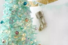 26 a modern mint green Christmas tree with colorful ornaments, a monogram and lights is a lovely and cool idea