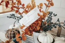 27 a bright Thanksgiving table with a striped runner, wheat, pinecones, leaves and pumpkins – faux and real ones plus blue napkins