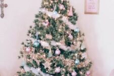 29 a Christmas tree decorated with pastel green and pink ornaments, stars, lights and fluffy garlands plus a star topper