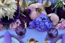 33 a glam Thanksgiving tablescape with a lilac tablecloth and napkins, lilac candles, purple, deep purple and violet blooms and gilded cutlery