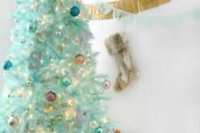 37 a modern mint green Christmas tree with colorful ornaments, a monogram and lights is a lovely and cool idea