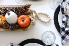 39 black and white plates accented with little orange pumpkin plates and buffalo check napkins are amazing for Thanksgiving