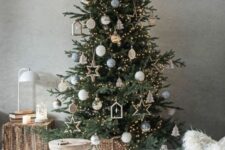 40 a Scandinavian Christmas tree with lights, wooden ornaments and some traditional baubles is a stylish idea