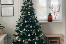 41 a Scandinavian Christmas tree with white and silver ornaments, snowballs, tree and snowflake-shaped ornaments