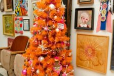 41 an orange Christmas tree with whimsical ornaments and beads is a lovely idea for a bold and quirky space
