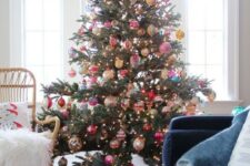 64 a Christmas tree with lights and colorful vintage ornaments and a bold tree skirt is a fantastic decor statement