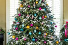 70 a vintage-inspired Christmas tree with beads, colorful ornaments of various shapes and a star on top