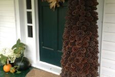 a large pinecone Christmas tree looks maximally natural and makes the porch cooler and fresher