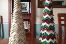 a neutral and green, red and white fabric piece cone-shaped Christmas trees, topped with a star and a pompom
