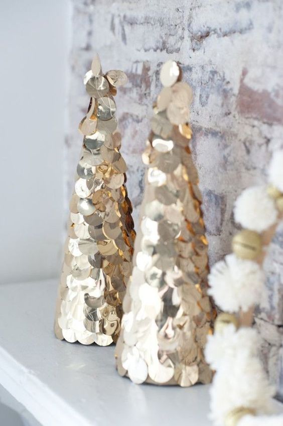 Large gold sequin cone shaped Christmas trees are great to decorate your space for winter holidays glam style