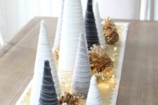 white, grey and graphite grey velvet cord cone Christmas trees, bleached pinecones and lights are great for holidays