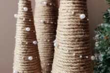 yarn cone shaped Christmas trees decorated with pearls and topped with silver stars will finish off your rustic holiday decor