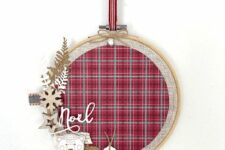 06 a lovely Christmas wreath made of an embroidery hoop, plaid fabric, wooden stars, snowflakes, tags and leaves is perfect for a rustic space
