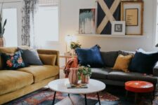 08 a bold mid-century modern space done with a printed rug, a couple of sofas and colorful pillows, a ledge gallery wall