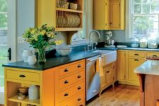 09 a sunny yellow kitchen with black coutnertops, a wooden kitchen island looks very inspiring, bold and cool