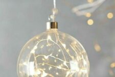 10 a clear glass Christmas ornament with lights is a cool idea – such decor will make your tree sparkle
