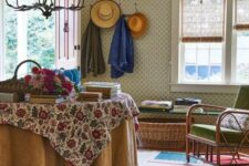 10 a cozy vintage-inspired interior with a bold rug, printed wallpaper, rattan furniture, floral print fabrics and books on the table