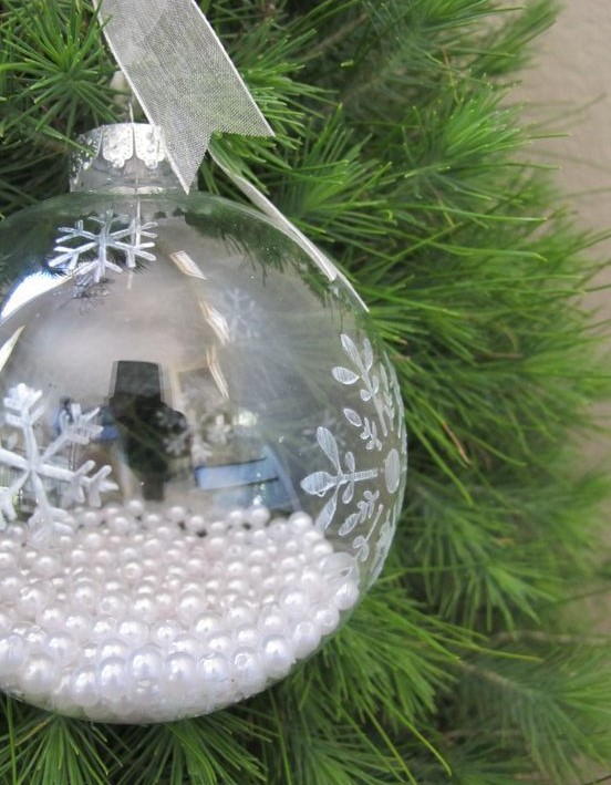 A clear snowflake ornament filled with pearls is a chic vintage inspired Christmas decoration or addition to a Christmas gift