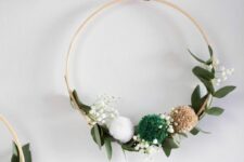 14 a simple and lovely Christmas embroidery hoop wreath with greenery, baby’s breath and pompoms is a lovely decoration for the holidays
