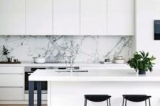 17 a chic white minimalist kitchen with touches of black for more drama and a white marble backsplash for a refined feel