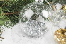 20 clear glass Christmas ornaments filled with stars are amazing for styling your Christmas tree