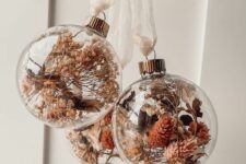 26 clear glass ornaments with dried blooms, leaves and grasses are amazing for boho Christmas decor