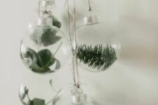 27 clear glass ornaments with greenery and evergreens are a gorgeous natural idea for Christmas, they will fit boho or woodland decor