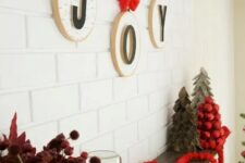 27 hoops with letters and red bows and ribbons are an amazing wall decoration for Christmas
