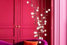 28 a hot pink living room with molding, a magenta loveseat, a catchy pendant lamp is jaw-dropping