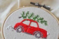 30 a fun and cool embroidery hoop Christmas ornament with a red car and a tree embroidered is an awesome decor idea