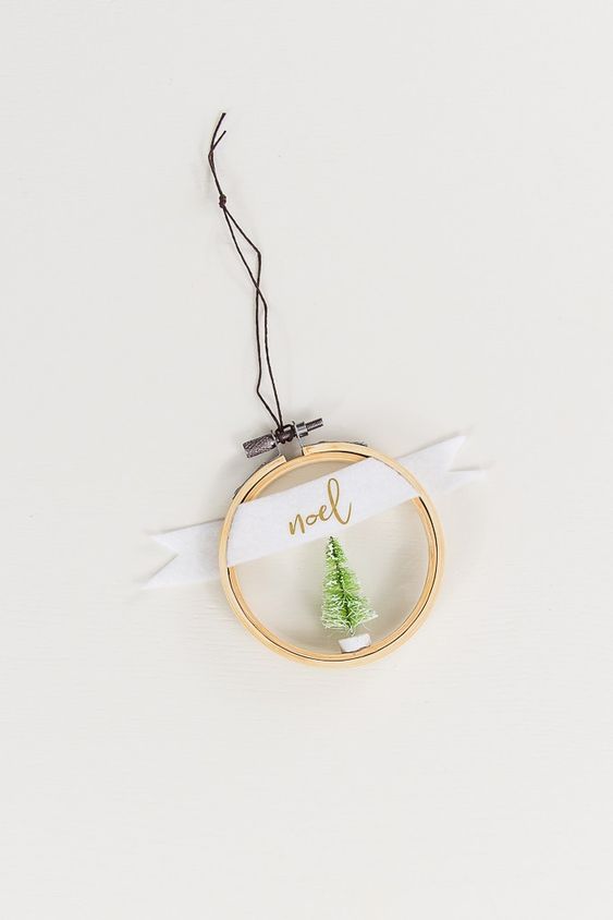 an embroidery hoop Christmas ornament with a bottle brush tree, a ribbon with a word is easy to recreate