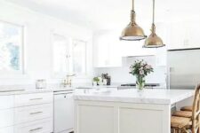 40 a white farmhouse kitchen with brass vintage touches and marble countertops for an eye-catchy touch