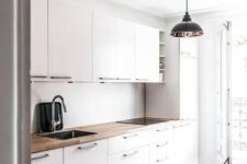 41 a modern white kitchen with a geometric floor and a wooden countertop to make it look more interesting