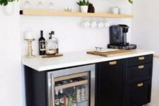 42 a small and catchy home bar with light-stained open shelves, black cabinetry, a wine cooler, various plants, bottles and candles