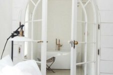 64 French arched doors leading to the bathroom make it more refined and chic at first glance