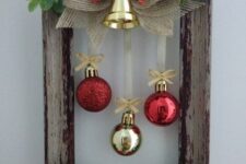 a lovely wreath with red and gold ornaments