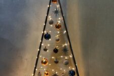 a frame Christmas tree with lights and various ornaments will be a beautiful alternative to a usual Christmas tree