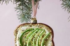 a unique Christmas ornament showing off an avocado toast with salt is a fantastic idea for styling a tree