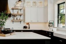 02 a black and white farmhouse kitchen with slatted walls, black and white shaker cabinets and a black black kitchen island