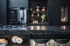07 a contemporary black kitchen with a large kitchen island with a marble countertop, built-in lights and metal stools