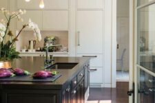 a lovely neutral kitchen with a bold kitchen island