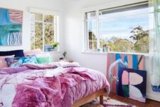 40 a maximalist ocean bedroom with simple furniture, colorful bedding and a bold artwork plus a gorgeous view