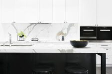 46 a refined contemporary kitchen with white shaker style cabinets, a black kitchen island, a white marble backsplash and countertops