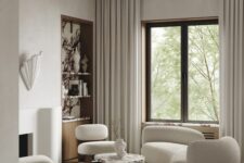 51 neutral living room with sculptural furniture, a built-in storage niche and neutral textiles