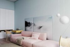 a cute living room with a pink sofa