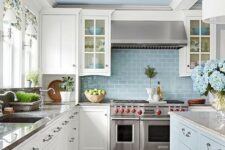 an elegant powder blue and white kitchen with touches of metallic shades and floral patterns for a chic look