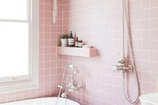light pink bathroom tiles on the walls and floor plus white create a modern girlish feel